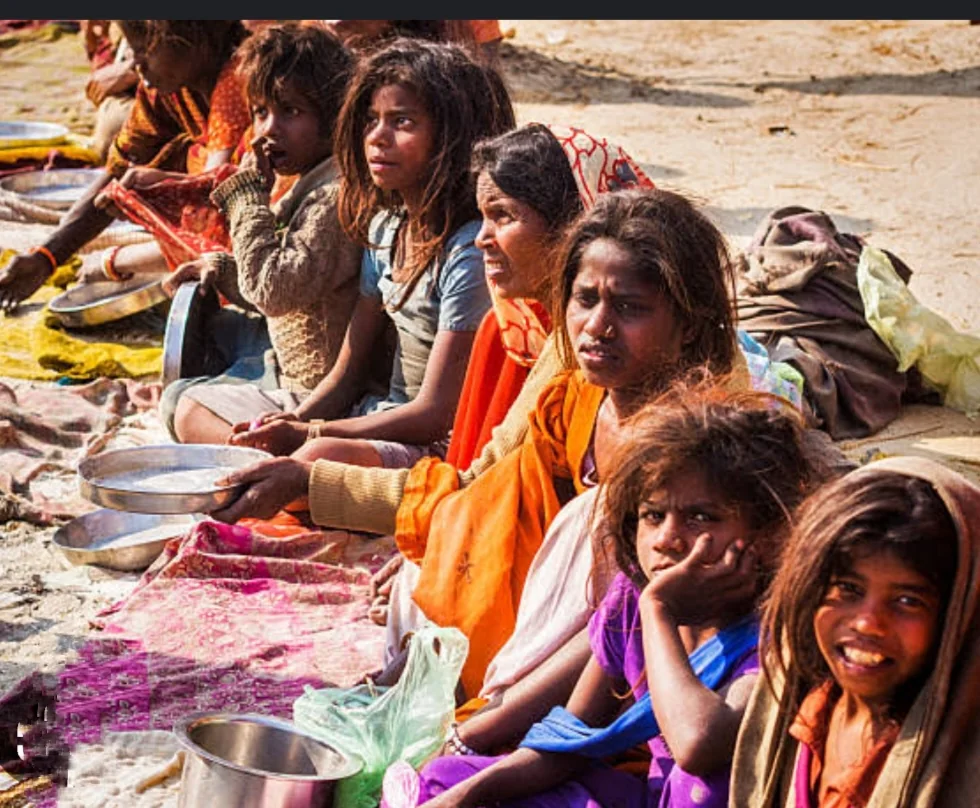 Women and children with empty food bowls